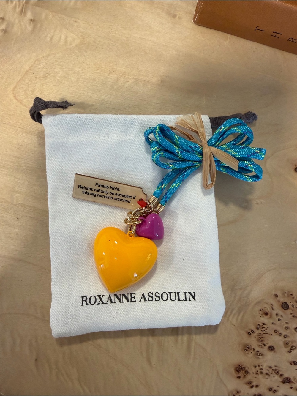 Roxanne Assoulin Turquoise Cord Necklace with Yellow and Pink Heart Charms - Picture 3 of 4